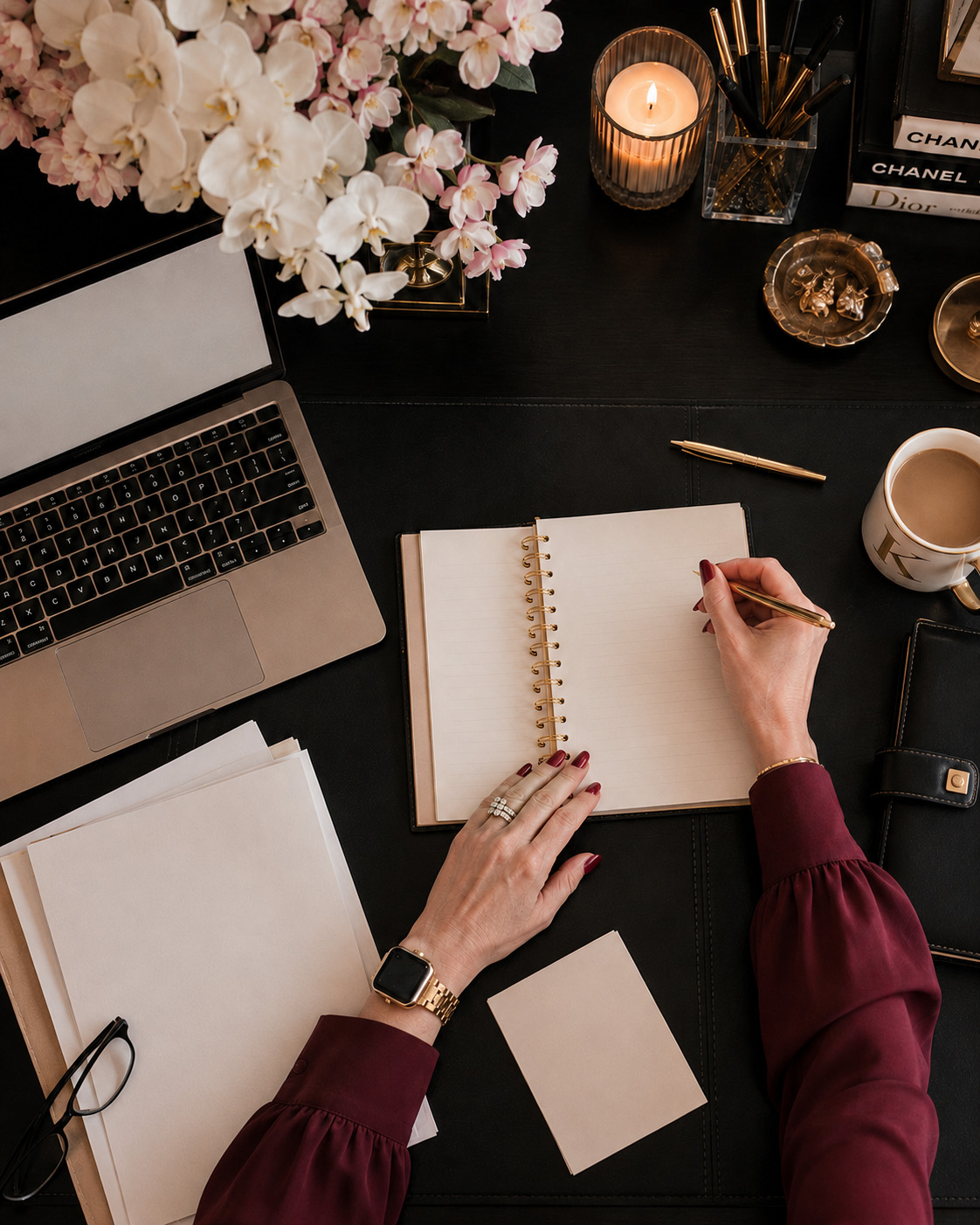 Planning notes at a desk with a gold pen