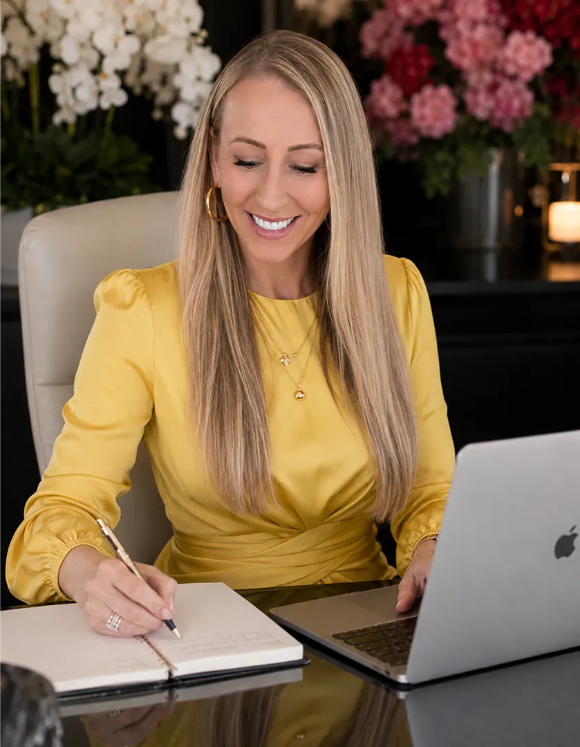 Kathryn Porritt writing at her desk